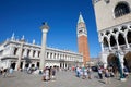 San Marco bell tower and National Marciana library with people in Venice, Italy