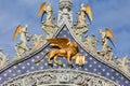 San Marco golden winged Lion statue with angels in Venice, Italy