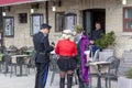 SAN MARINO - APRIL 09, 2019 - A policeman issues a fine to street actors