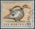 San Marino postage stamp from the Etruscan art series depicting Duck-shaped Jug with Flying Lasa Royalty Free Stock Photo