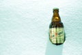 San Miguel beer bottle in snow