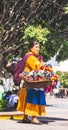 Mexican woman with traditional dress selling handcrafts Royalty Free Stock Photo