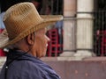 Man with hat relaxed and gazing in the downtown area of San Miguel de Allende
