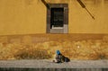 San Miguel De Allende, Mexico-January 18, 2017: An elderly woman sits on a sidewalk