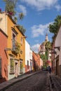 San Miguel de Allende Mexico old town street with a cathedral Royalty Free Stock Photo