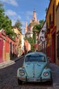 San Miguel de Allende Mexico old town street with Volkswagen bug car Royalty Free Stock Photo