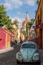 San Miguel de Allende Mexico old town street with Volkswagen bug car Royalty Free Stock Photo