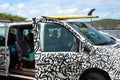 San Miguel, Portugal, June 2019. Painted car with a surfboard on beach of Praia do Areal de Santa Barbara, San Miguel, Azores.