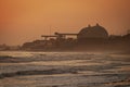 San Onofre nuclear power plant at sunset in misty fog with beach in foreground