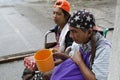 Lady, Blind Man beside disabled Beggar in wheelchair at Church yard Gate Portal