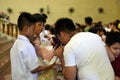 Man kiss the icon statue of infant Jesus Christ on Christmas Day Royalty Free Stock Photo