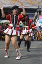 Band majorette with massive thighs and legs dances using worn out boots on street Royalty Free Stock Photo