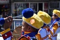 Male band member plays drum during town festivity procession