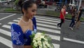 May flower pageantry young woman in ornate gown romp the street