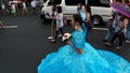 May flower pageantry young woman in ornate gown romp the street