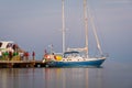 Passengers getting off water taxi boat after arriving to San Pedro, Ambergris Caye from Belize City at dusk Royalty Free Stock Photo