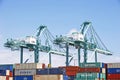 San Pedro/California - April 4, 2020: Los Angeles Harbor Shipyard cranes at work unloading cargo ship containers. Royalty Free Stock Photo