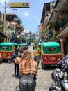 A young female tourist walking through the Mayan village streets of San Pedro La Laguna, Guatemala.