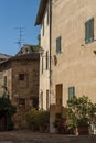 SAN QUIRICO D`ORCIA, ITALY - OCTOBER 30, 2016 - Charming narrow street in the town of San Quirico d`Orcia Royalty Free Stock Photo