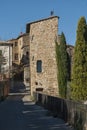 SAN QUIRICO D`ORCIA, ITALY - OCTOBER 30, 2016 - Charming narrow street in the town of San Quirico d`Orcia Royalty Free Stock Photo
