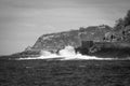 San sebastian coastline cliff rocks in black and white, spain