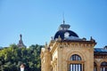 San Sebastian Donostia, Basque country, Spain: Fragment of the facade of The City Hall building.In the background Jesus Christ Royalty Free Stock Photo