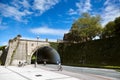 San Sebastian Donostia, Basque country, Spain: A young man on a bicycle rides under an stone bridge Royalty Free Stock Photo