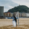 San Sebastian or Donostia is a coastal city and located on the coast of the Bay of Biscay, Spain. Surfer on the coast Royalty Free Stock Photo