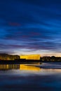 Kursaal auditorium illuminated at night is reflected in the beach of Zurriola, city of San Sebastian Royalty Free Stock Photo