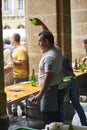 Waitress pouring Cider in a traditional event in San Sebastian.