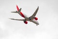 Avianca company plane in full flight, lowering the landing gear to land at Adolfo Suarez airport