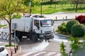 Truck disinfecting the streets with jets of disinfecting liquid due to the alertness for the coronavirus