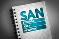 SAN - Storage Area Network acronym on notepad, technology concept background