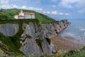 The San Telmo Hermitage chapel and Flysch rock formations on the Basque Country coast in Zumaia Royalty Free Stock Photo
