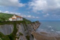 The San Telmo Hermitage chapel and Flysch rock formations on the Basque Country coast in Zumaia Royalty Free Stock Photo