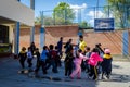 Yungay, Peru, July 14, 2014:  San Viator schoolyard with young children playing together with the teacher and cooperators around h Royalty Free Stock Photo