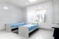 Sanatorium, hospital or clinic white chamber with two bed. CIS location