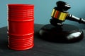 Sanction and regulation. Barrel of oil and gavel Royalty Free Stock Photo