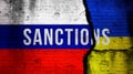 Sanctions against Russia because of war in Ukraine concept background with text. Flag background, cracked brick wall