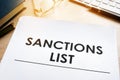 Sanctions list on a desk. Government act for sanctioned countries concept. Royalty Free Stock Photo