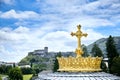 Sanctuary of Lourdes. Dome of The Basilica of Our Lady of the Rosary. The Golden Crown and the Cross. Blue sky with clouds. Hautes Royalty Free Stock Photo