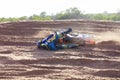 Sand, accident and motorbike for sports with action for challenge or competition with power. Speed, mistake and desert