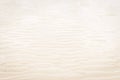 Sand background. Wet sand in low tide. Beige curves of sand. Wavy surface. Coastal feature. Sand pattern. Tropical climate. Royalty Free Stock Photo