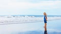 On sand beach dreaming child look at sea surf landscape