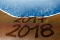 2017 2018 sand beach New Year is coming Royalty Free Stock Photo