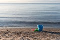 Sand beach with plastic toys Royalty Free Stock Photo