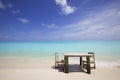 Sand Beach with Table and Chairs Royalty Free Stock Photo