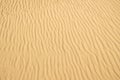 Sand of a beach with wave patterns Royalty Free Stock Photo