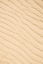 Sand of a beach with wave patterns Royalty Free Stock Photo