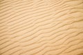 Sand of a beach with wave patterns Royalty Free Stock Photo